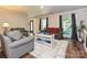 A welcoming living room with hardwood floors, comfortable seating and natural light at 8200 Lansford Rd, Charlotte, NC 28277