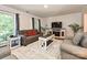 Cozy living room with bright, natural light, hardwood floors, and modern furniture at 8200 Lansford Rd, Charlotte, NC 28277