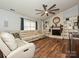 Relax in this living room featuring a fireplace, built-in shelving, and lots of light at 8200 Lansford Rd, Charlotte, NC 28277