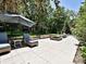 Stone patio with a seating area and a fire pit is ideal for outdoor entertaining at 8200 Lansford Rd, Charlotte, NC 28277