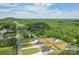 Wide aerial shot of a neighborhood with tree-lined streets and well-maintained homes at 959 Robinson Rd, Gastonia, NC 28056