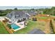 Beautiful backyard featuring a pool, lounge chairs, patio, fire pit, and a trampoline at 959 Robinson Rd, Gastonia, NC 28056
