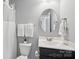 Bathroom featuring a mirror, sink, toilet, and a shower with a white curtain at 959 Robinson Rd, Gastonia, NC 28056