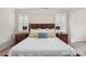 Comfortable bedroom featuring a well-made bed, side tables with lamps, and plantation shutters at 959 Robinson Rd, Gastonia, NC 28056