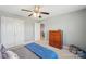 Bedroom with two closets, a fan, and a wooden dresser at 959 Robinson Rd, Gastonia, NC 28056
