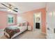 Charming pink bedroom with ensuite bathroom featuring natural light from window at 959 Robinson Rd, Gastonia, NC 28056