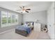 Bedroom with a window with white shutters, fan, and nautical themed decor at 959 Robinson Rd, Gastonia, NC 28056