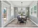 Charming breakfast area with light gray walls, hardwood floors, and a view to the patio at 959 Robinson Rd, Gastonia, NC 28056