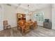 Dining room featuring hardwood floors, coffered ceilings, and natural light at 959 Robinson Rd, Gastonia, NC 28056