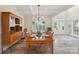 Dining room featuring hardwood floors, coffered ceilings, and natural light at 959 Robinson Rd, Gastonia, NC 28056