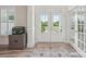 Inviting foyer with hardwood floors, bright glass front door, and a decorative aquarium at 959 Robinson Rd, Gastonia, NC 28056
