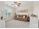 Comfortable home office with a soft sofa, aircraft artwork, and a light-filled window at 959 Robinson Rd, Gastonia, NC 28056
