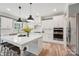 Well-lit kitchen with white cabinets, stainless steel appliances, and a large island with seating at 959 Robinson Rd, Gastonia, NC 28056