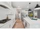 Bright and spacious kitchen with white cabinetry, stainless steel appliances, and large island perfect for cooking at 959 Robinson Rd, Gastonia, NC 28056