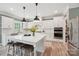 Elegant kitchen with a large island, stainless appliances, wood floors, and stylish pendant lighting at 959 Robinson Rd, Gastonia, NC 28056