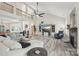 Spacious living room with a vaulted ceiling, fireplace, and abundant natural light at 959 Robinson Rd, Gastonia, NC 28056