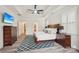 This is a spacious main bedroom with a ceiling fan, TV, and a decorative rug at 959 Robinson Rd, Gastonia, NC 28056