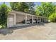 Spacious covered parking area with individual storage units, offering convenient and secure vehicle parking at 1025 Ardsley Rd # 103, Charlotte, NC 28207