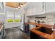 Well-appointed kitchen with wood countertop, white cabinetry and stainless steel appliances at 1025 Ardsley Rd # 103, Charlotte, NC 28207