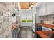 Charming kitchen with custom wood countertop, exposed brick and stainless steel appliances at 1025 Ardsley Rd # 103, Charlotte, NC 28207