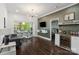 Cozy living area with unique decor, stylish wet bar and access to windowed breakfast nook at 1025 Ardsley Rd # 103, Charlotte, NC 28207
