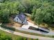 Aerial view of the new construction home and surrounding trees at 1030 Little Cowgirl Ln, Cleveland, NC 27013