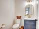 Stylish powder room with a modern vanity, elegant mirror, and designer fixtures at 1030 Little Cowgirl Ln, Cleveland, NC 27013
