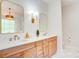 Bright bathroom featuring a double vanity with a stone countertop and bronze hardware at 1030 Little Cowgirl Ln, Cleveland, NC 27013