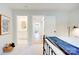 Bright bedroom with en suite bathroom and hardwood floors in hallway at 1030 Little Cowgirl Ln, Cleveland, NC 27013