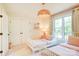 Comfortable bedroom with twin beds, neutral carpet, and a large window for natural light at 1030 Little Cowgirl Ln, Cleveland, NC 27013