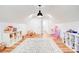 Versatile bonus room with hardwood floors, great lighting, and ample open space for recreational activities at 1030 Little Cowgirl Ln, Cleveland, NC 27013