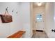 Hallway entry featuring a coat rack with bench seating and an exterior door at 1030 Little Cowgirl Ln, Cleveland, NC 27013