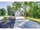 Beautiful home showcasing a long driveway, well-maintained lawn, and charming architectural design at 1030 Little Cowgirl Ln, Cleveland, NC 27013
