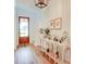 Charming foyer featuring beautiful hardwood floors and stylish console tables at 1030 Little Cowgirl Ln, Cleveland, NC 27013