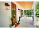A welcoming front porch features white rocking chairs and a wood plank ceiling at 1030 Little Cowgirl Ln, Cleveland, NC 27013