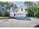 This beautiful home features a three car garage, basketball hoop, long driveway, and a meticulously kept lawn at 1030 Little Cowgirl Ln, Cleveland, NC 27013