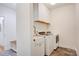 Functional laundry room with modern washer/dryer, farm sink, and storage at 1030 Little Cowgirl Ln, Cleveland, NC 27013