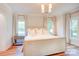 Elegant main bedroom with neutral tones, wood floors, and modern lighting fixtures at 1030 Little Cowgirl Ln, Cleveland, NC 27013