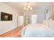 Spacious main bedroom featuring neutral tones, hardwood floors and a mounted television at 1030 Little Cowgirl Ln, Cleveland, NC 27013