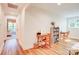 Bright playroom with hardwood floors, study areas, and seamless access to other areas at 1030 Little Cowgirl Ln, Cleveland, NC 27013