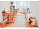 Bright, well-lit playroom featuring wood floors, multiple study areas, and toy storage at 1030 Little Cowgirl Ln, Cleveland, NC 27013