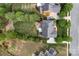 An aerial view of backyard, including a patio, lawn, and manicured landscaping at 1116 Crooked River Dr, Waxhaw, NC 28173