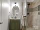 Bathroom featuring a tiled walk-in shower and stylish vanity at 1116 Crooked River Dr, Waxhaw, NC 28173