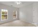 Bedroom with neutral carpet and two large windows, providing ample natural light at 1116 Crooked River Dr, Waxhaw, NC 28173