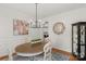 Bright dining room features a round table, modern light fixture, and stylish decor at 1116 Crooked River Dr, Waxhaw, NC 28173