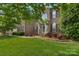 Charming two-story brick home with a well-manicured lawn and inviting front entrance at 1116 Crooked River Dr, Waxhaw, NC 28173