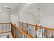 Second floor hallway with wood railing overlooking the living room at 1116 Crooked River Dr, Waxhaw, NC 28173