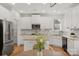 Well-lit kitchen features stainless steel appliances, granite countertops, and white cabinets at 1116 Crooked River Dr, Waxhaw, NC 28173