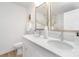 Bright bathroom features double vanity with quartz countertop and modern fixtures at 1148 Thayer Glen Ct, Charlotte, NC 28213