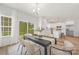 Bright dining area featuring neutral decor, a modern table, and a view to the kitchen at 1148 Thayer Glen Ct, Charlotte, NC 28213